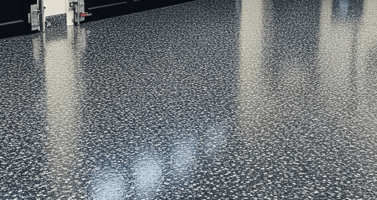 Full flake epoxy garage floor with gray and white chips