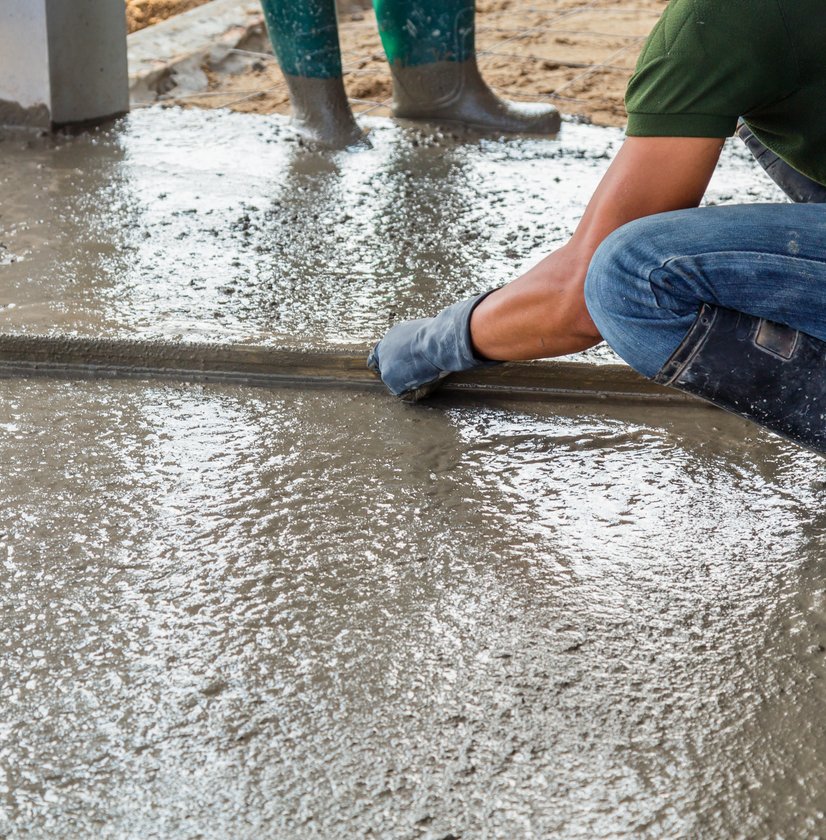 Concrete finisher smoothing a freshly poured section